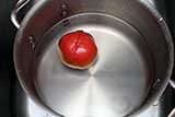Place tomato in icy cold water to prevent cooking.