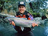 Brad Benter holds wild rainbow trout in Alaska.<em> U.S. Fish and Wildlife Service.</em>
