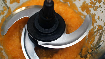 a strong food processor purees pumpkin within a minute