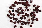 Whole annatto seeds resemble buckwheat grouts in size and shape.
