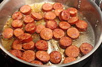 Cut sausage is pan-fried