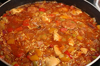 Meat stock and rice is added. Other meats like chicken or seafood are often included