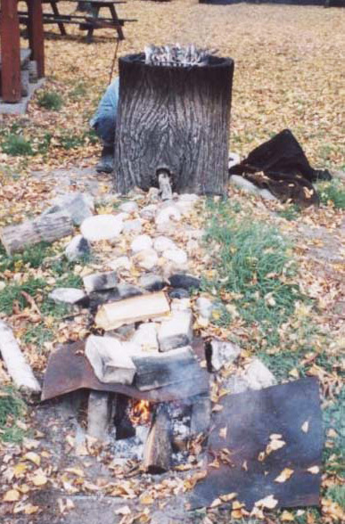 Tree stump meat smoker